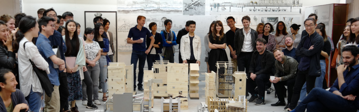 People gathering around architecture models