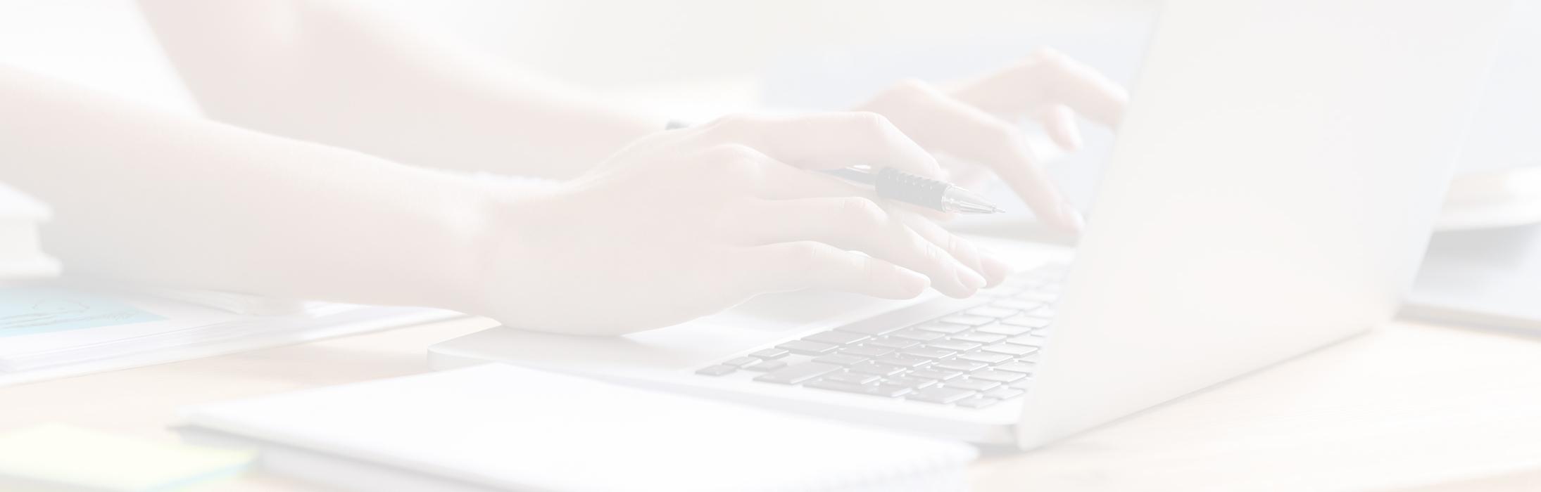 Typing on a laptop