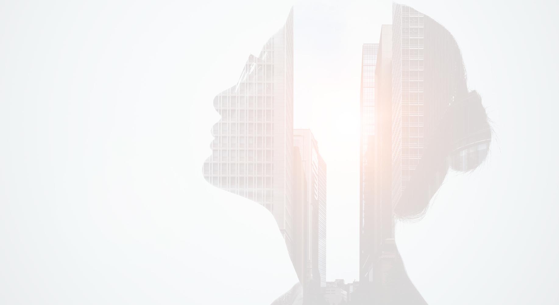 Woman head silhouette on a bright city background