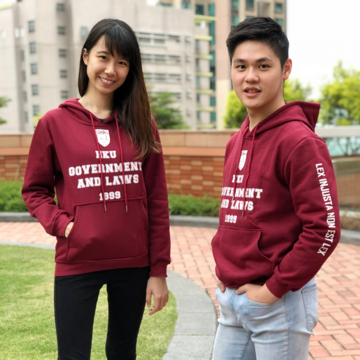 Students wearing "HKU Government and Laws 1999" hoodie on campus