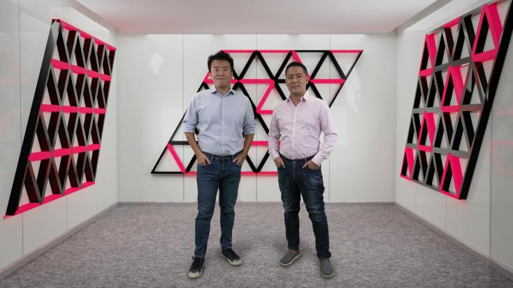 Research Assistant Professor Zheng YAN (on the right) and Associate Professor Zi Yang MENG from HKU Department of Physics standing in the imaginary space decorated with the novel quantum states they discovered. The HKU Physics team and their collaborators designed a soft-constrained model to describe the programmable quantum simulator and predict the novel entangled states on it. The research work has been published in Nature Communications recently.